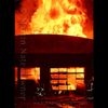 photograph of firefighters at warehouse blaze