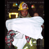 photograph of firefighter with child